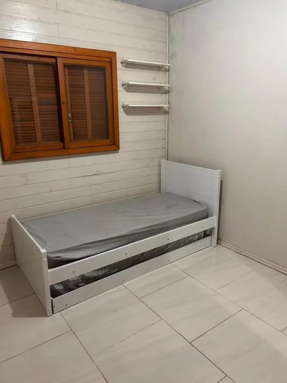 Casa com três quartos, piscina e área Gourmet, Torres, na Rua Dionel Ferro em Torres/RS — foto 2