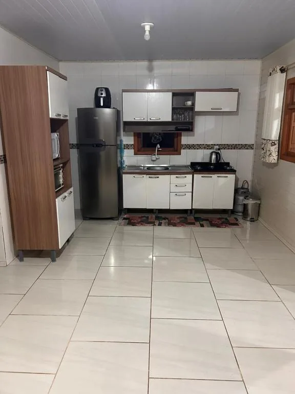 Casa com três quartos, piscina e área Gourmet, Torres, na Rua Dionel Ferro em Torres/RS — foto 4