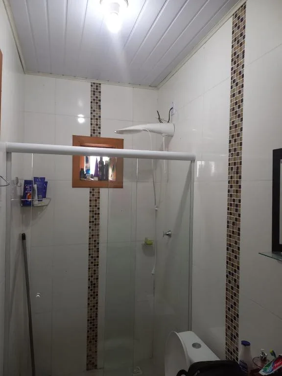 Casa com três quartos, piscina e área Gourmet, Torres, na Rua Dionel Ferro em Torres/RS — foto 8