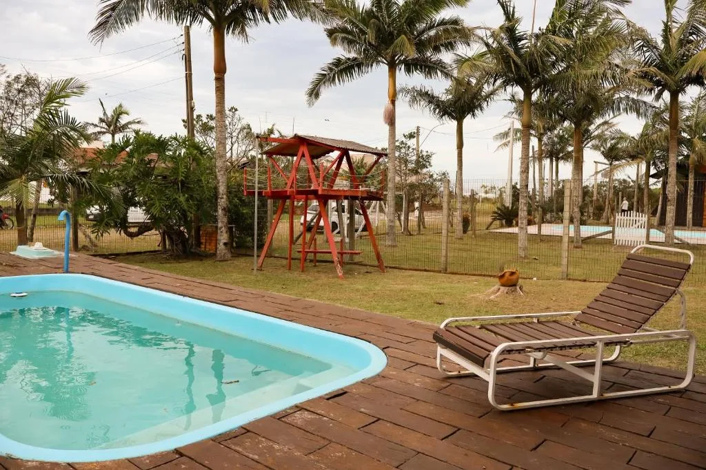 Casa com piscina patio e campinho em torres 1 quadra mar, Torres, na R. das Acácias em Torres/RS — foto 4