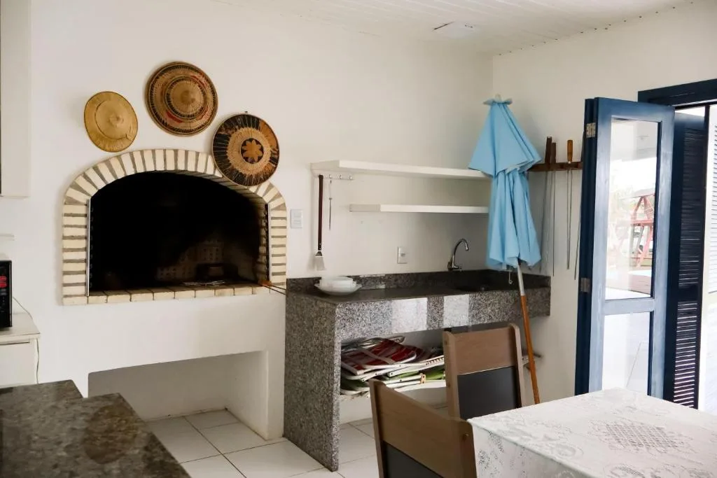 Casa com piscina patio e campinho em torres 1 quadra mar, Torres, na R. das Acácias em Torres/RS — foto 9